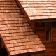 Close Up View of cedar shake roof installation for new construction residential cabin hom