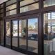 Brown aluminum commercial windows near hotel entry