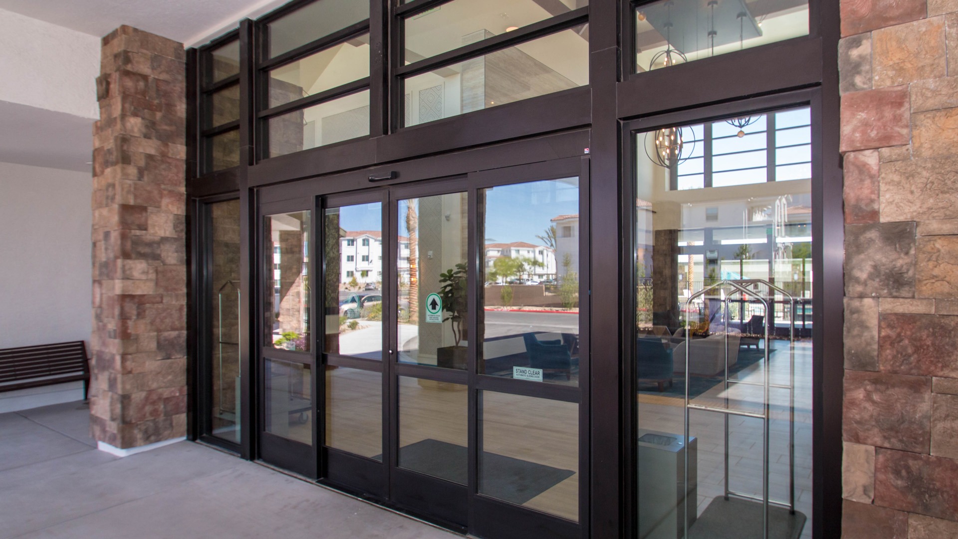 Brown aluminum commercial windows near hotel entry