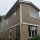new residential certainteed beige siding replacement for top portion of home